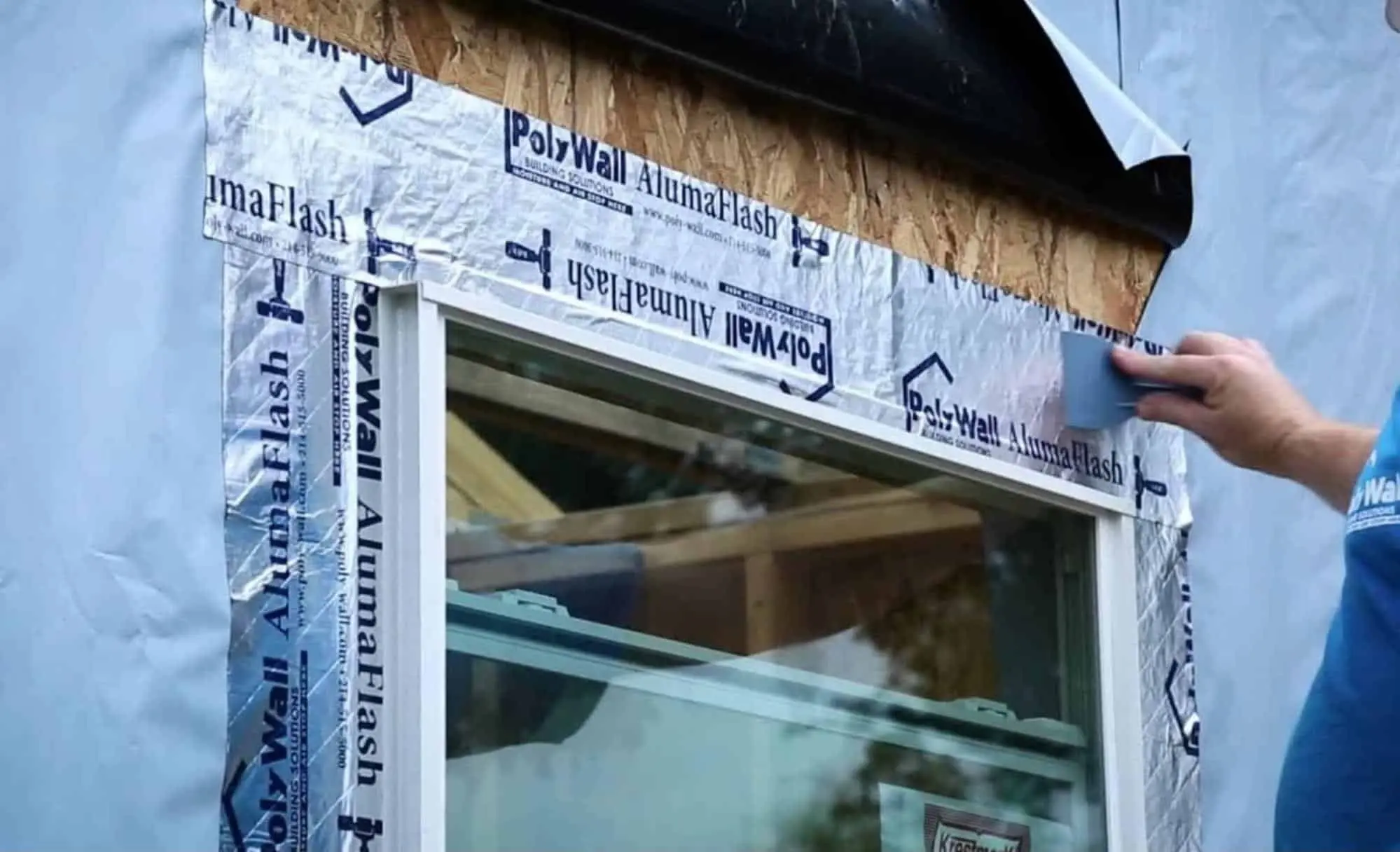 side flashing installation on window with 2-inch overlap and smooth adhesion